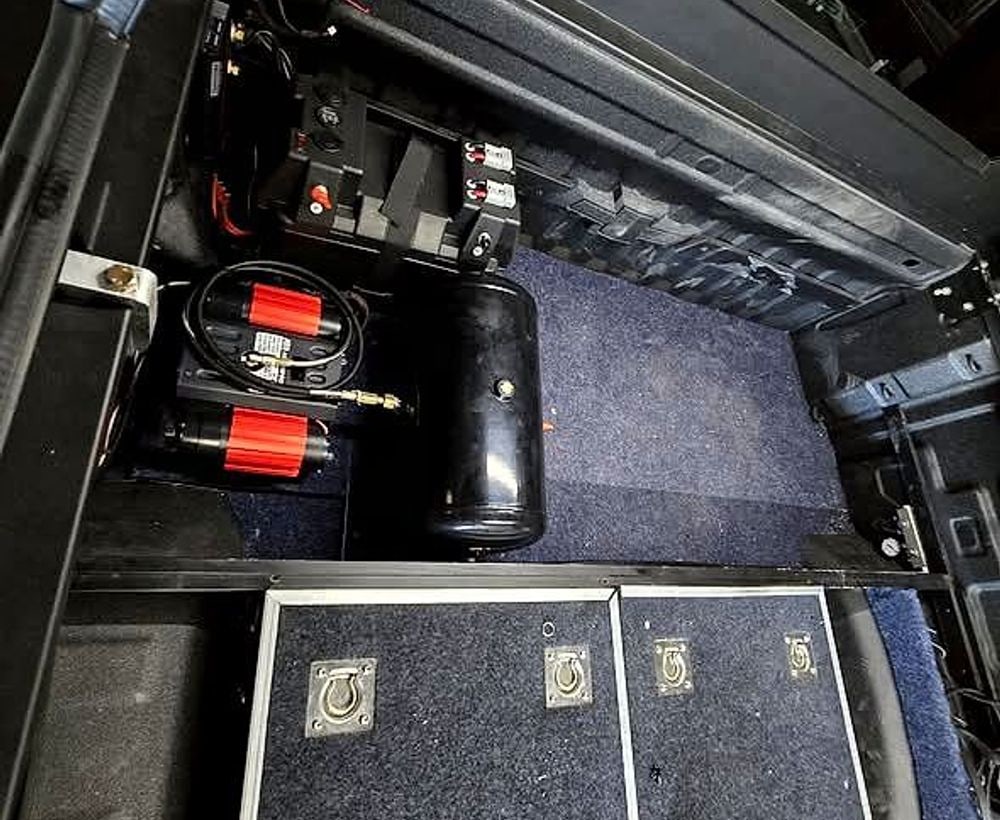 Dual battery and Redarc setup installed in a vehicle cargo area