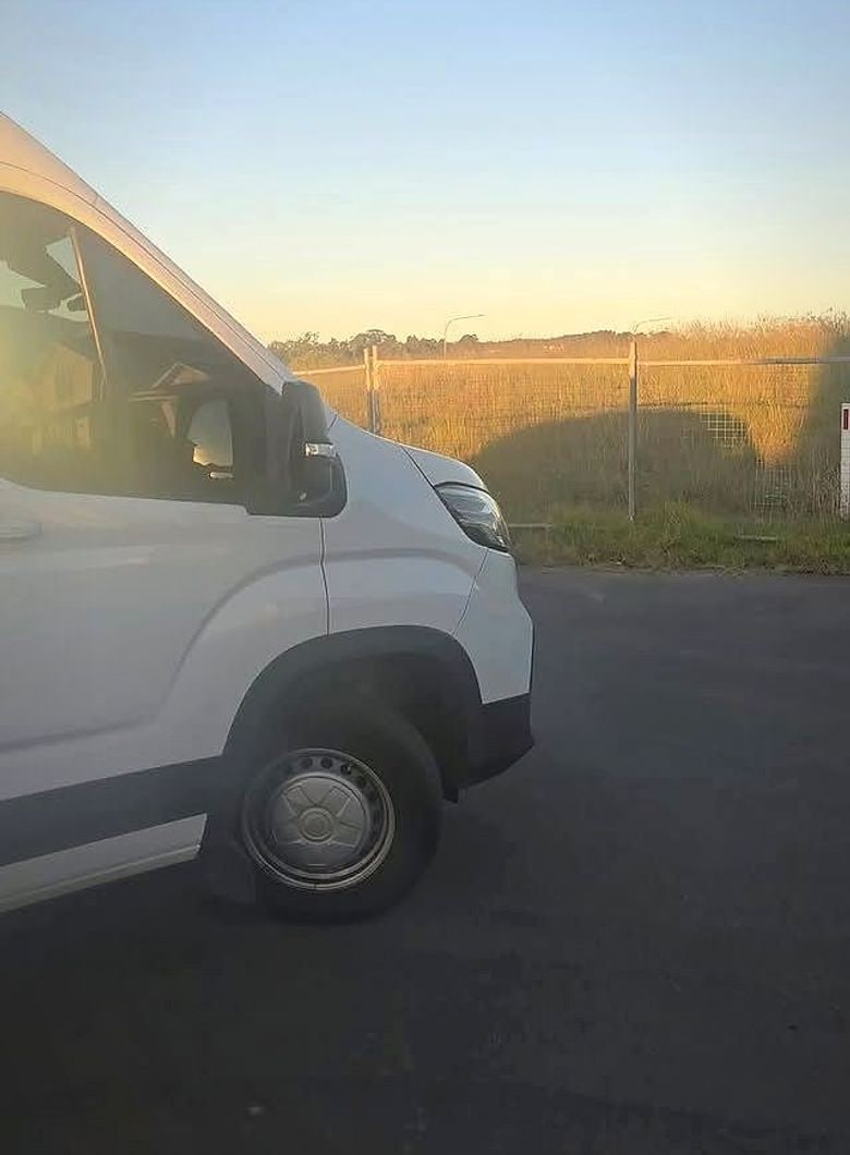 Hot Wired Installations mobile auto electrical van out on a job at sunset